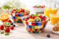 Preview: Buntes Porzellan Bowl Set mit frischen Früchten und Orangensaft – moderne Schalen im farbenfrohen Karomuster für Frühstück, Müsli oder Obstsalat.